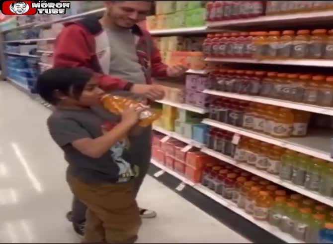 Video :Juice is offered to his daughter by a parent, who then puts the bottles back on the shelf